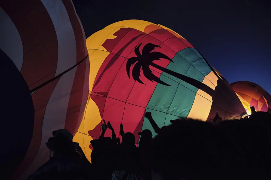 Hot-air balloon glowing at dawn in Albuquerque