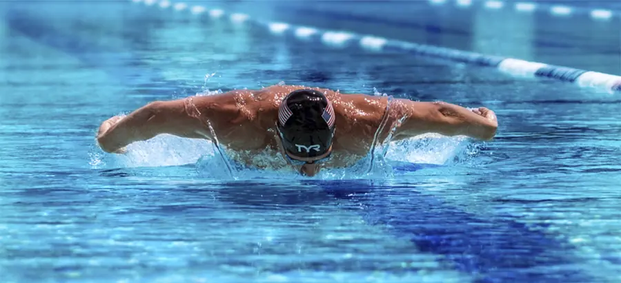 Ryan Lochte cutting through blue water in butterfly stroke