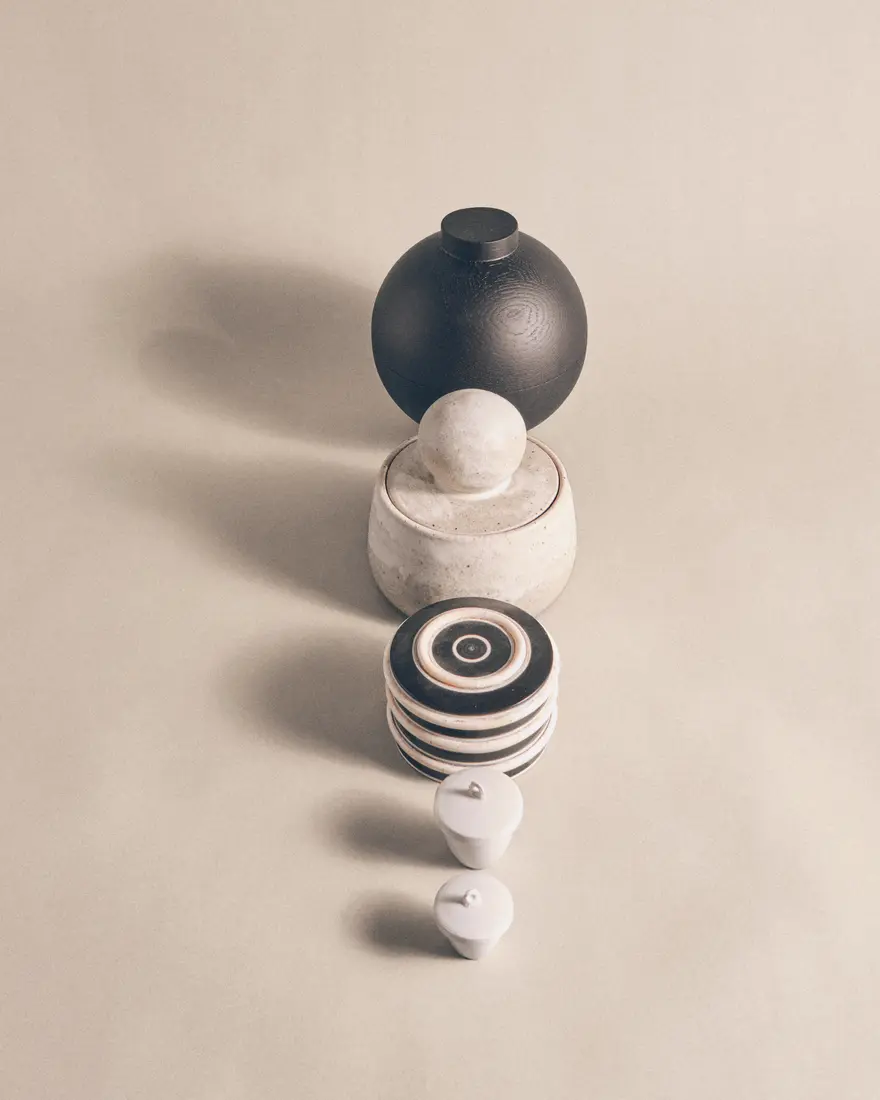 Graphic procession of ceramic and glass spheres casting long shadows